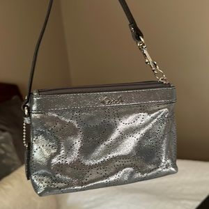 Big enough for a phone! And credit cards it’s a wristlet it’s brand new